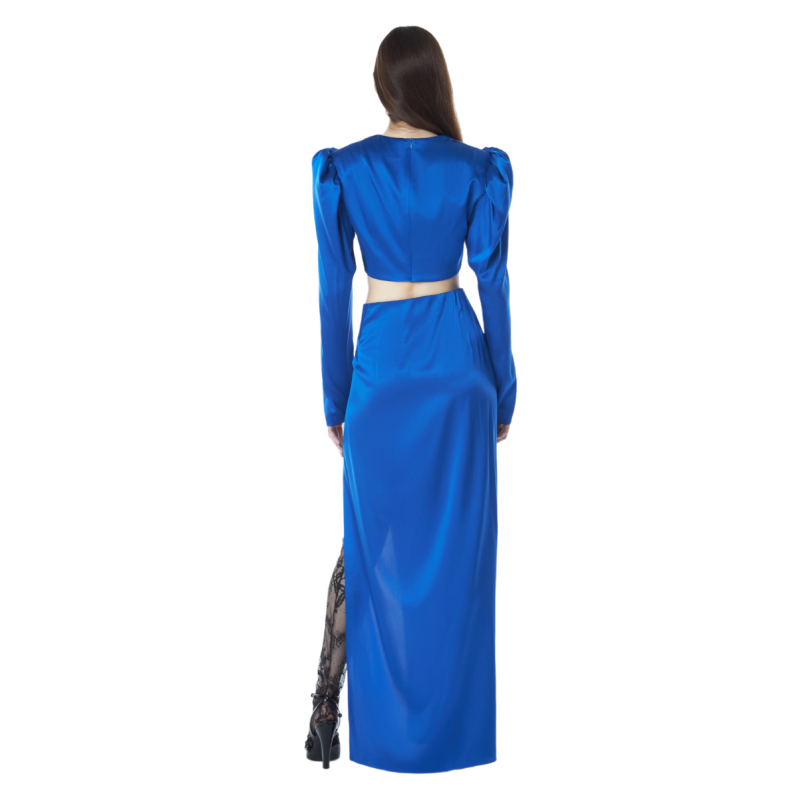 A suit made of a blouse with lantern sleeves and a maxi skirt with a high slit made of satin silk